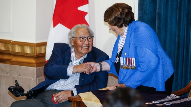 Lt.-Gov. Anita Neville, chancellor of the Order of Manitoba, presents Manitoba's highest honour to Murray Sinclair during an investiture ceremony at the Manitoba Legislature in Winnipeg Thursday, July 25, 2024. (John Woods/The Canadian Press)