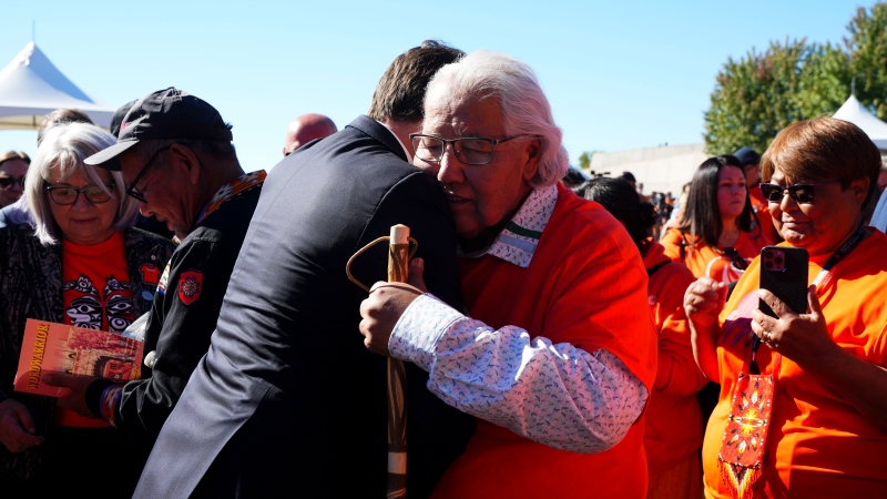 Prime Minister Justin Trudeau embraces Murray Sinclair as they take part in ceremonies for the National Day of Truth and Reconciliation in Ottawa on September 30, 2022. Sinclair, who chaired the Truth and Reconciliation Commission on residential schools, has died at the age of 73. (Sean Kilpatrick/The Canadian Press)