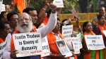 Activists of United Hindu Front, a right wing group reacting to Canada's allegation that Indian Home Minister Amit Shah ordered the targeting of Sikh activists inside Canada, hold placards during a protest in New Delhi, India, Tuesday, Nov. 5, 2024. (AP Photo/Manish Swarup)