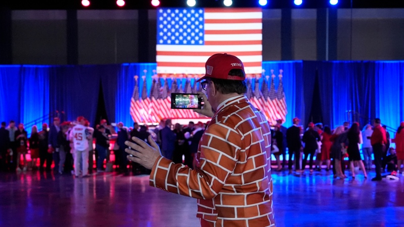 A supporter arrives at an election night watch party for Republican presidential nominee former U.S. President Donald Trump Tuesday, Nov. 5, 2024, in West Palm Beach, Fla. (AP Photo/Julia Demaree Nikhinson) 