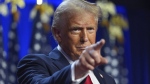 Republican presidential nominee former President Donald Trump arrives at an election night watch party at the Palm Beach Convention Center, Wednesday, Nov. 6, 2024, in West Palm Beach, Fla. (AP Photo/Evan Vucci)