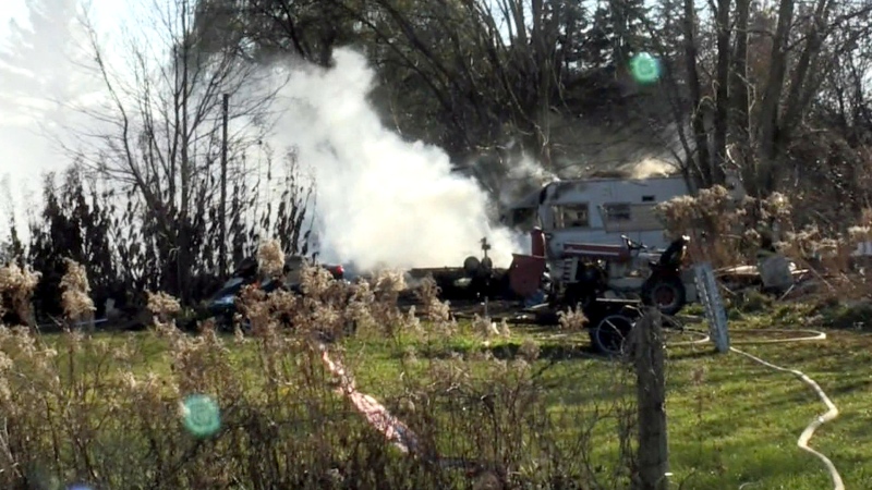 Camper trailer engulfed in flames