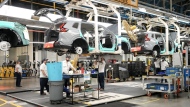 Honda employees work along the vehicle assembly line in Alliston, Ont., on Thursday, April 25, 2024.  THE CANADIAN PRESS/Nathan Denette