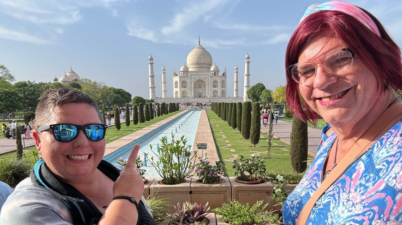 Tam Asbury, left, and Bobbi Waterman during a visit to the Taj Mahal in India. (Tam & Bobbi Waterman via CNN Newsource)