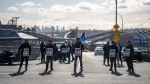 Employers and more than 700 workers embroiled in a labour dispute that led to a lockout at British Columbia's ports will attempt to reach a deal when talks restart this weekend. Workers picket at Neptune Terminal during an International Longshore and Warehouse Union labour dispute in North Vancouver, on Tuesday, November 5, 2024. THE CANADIAN PRESS/Ethan Cairns