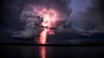 Colourful lightning illuminates the sky in Knee Lake, Man. on Aug. 29, 2022. (Wayne Boychuk)