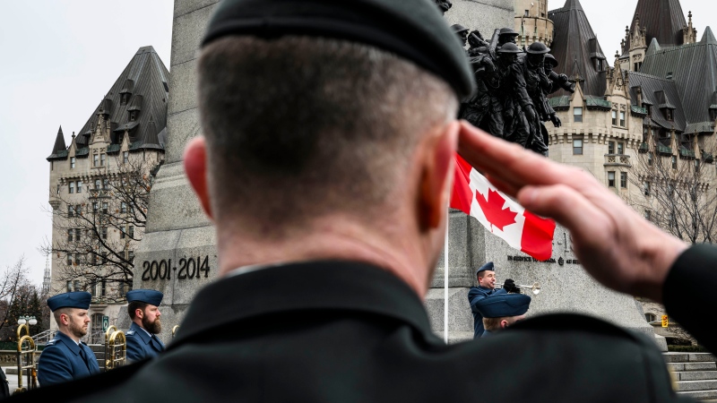 A Canadian Armed Forces member salutes as a bugler plays during a ceremony marking the 10th anniversary of the end of Canada’s mission in Afghanistan, at the National War Memorial in Ottawa, on Sunday, March 10, 2024. THE CANADIAN PRESS/Justin Tang