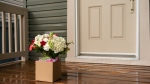 Flowers sit atop a front porch. (Source: Getty Images) 