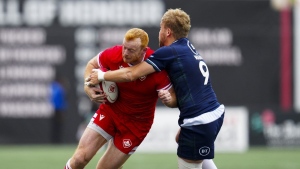 Canada's Peter Nelson gets tackled by Scotland's Gus Warr during first half of men's rugby action in Ottawa on Saturday, July 6, 2024. (THE CANADIAN PRESS/Sean Kilpatrick)