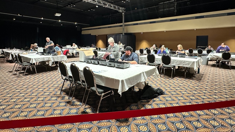 Workers with Elections Saskatchewan took part in the final vote counting process on Saturday. (Angela Stewart / CTV News) 