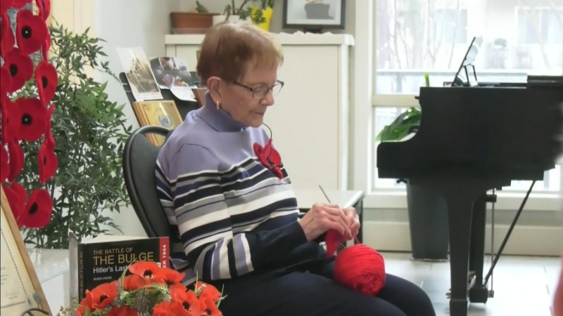 Red Deer senior crocheting poppies 