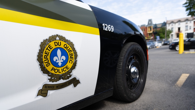 A Quebec provincial police officer has been suspended for 15 days without pay after throwing a piece of a young motorcycle accident victim's skull into a ravine in 2021. A Surete du Quebec police car is seen at their headquarters in Montreal, Sept. 10. THE CANADIAN PRESS/Christinne Muschi
