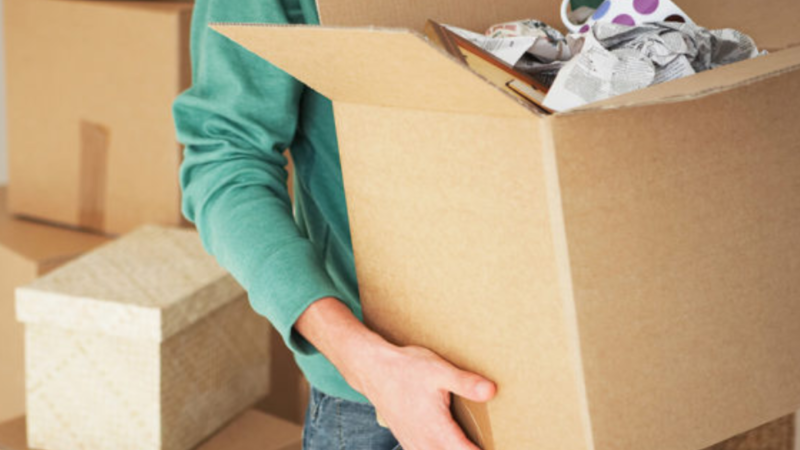 A man packs up his possessions in cardboard boxes in this undated file image. 