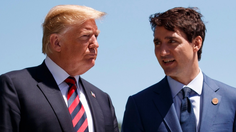 In this June 8, 2018 file photo, President Donald Trump talks with Canadian Prime Minister Justin Trudeau during a G-7 Summit welcome ceremony in Charlevoix, Canada (AP Photo / Evan Vucci)