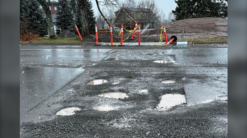 Potholes on a road in Dieppe, N.B., caused at least one driver thousands of dollars of damage to his vehicle. (CTV Atlantic/Alana Pickrell)