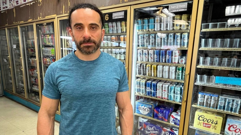 Terry Yaldo, owner of Midway Convenience on Wyandotte Street East, seen in front of the alcohol section in his store in Windsor, Ont. on Nov. 13, 2024. (Chris Campbell/CTV News Windsor)