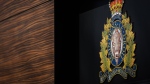 The RCMP logo is seen outside the force's 'E' division headquarters in Surrey, B.C., on March 16, 2023. (Darryl Dyck / The Canadian Press)