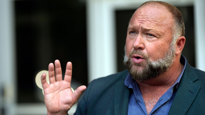 Right-wing conspiracy theorist Alex Jones speaks outside the federal courthouse after a bankruptcy hearing Friday, June 14, 2024, in Houston. (AP Photo/David J. Phillip)