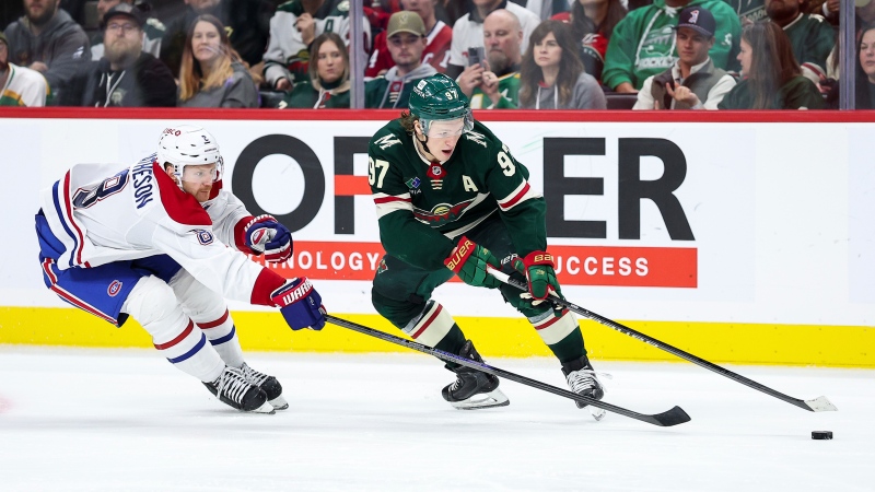 Minnesota Wild left wing Kirill Kaprizov (97) skates with the puck as Montreal Canadiens defenceman Mike Matheson (8) defends during the second period of an NHL hockey game Thursday, Nov. 14, 2024, in St. Paul, Minn. (AP Photo/Matt Krohn)