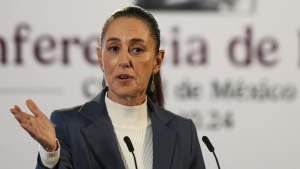 Mexican President Claudia Sheinbaum gives a media briefing from the National Palace in Mexico City, Oct. 2, 2024, the morning after her inauguration. (AP Photo/Fernando Llano, File)
