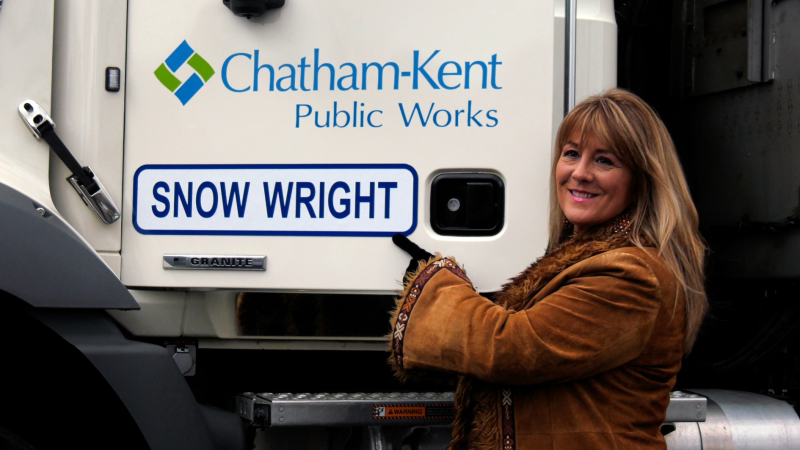 Canadian country music star Michelle Wright shows off the snowplow sporting her surname, Friday, November 15, 2024 (Travis Fortnum/CTV News Windsor)