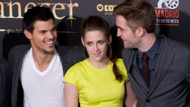 Taylor Lautner, Kristen Stewart and Robert Pattinson pose during a photo call at the Spanish premiere of the film 'The Twilight Saga: Breaking Dawn-Part 2' in Kinepolis Cinema in Madrid, Spain, Thursday, Nov. 15, 2012. (Gabriel Pecot/AP Photo)