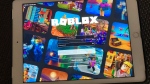 The gaming platform Roblox is displayed on a tablet, Saturday, Oct. 30, 2021 in New York. (AP Photo/Leon Keith)