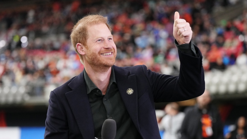 Prince Harry, the Duke of Sussex, reacts to football fans during a pre-game television interview prior to first half CFL football action at the 111th Grey Cup in Vancouver on Sunday, November 17, 2024. THE CANADIAN PRESS/Darryl Dyck