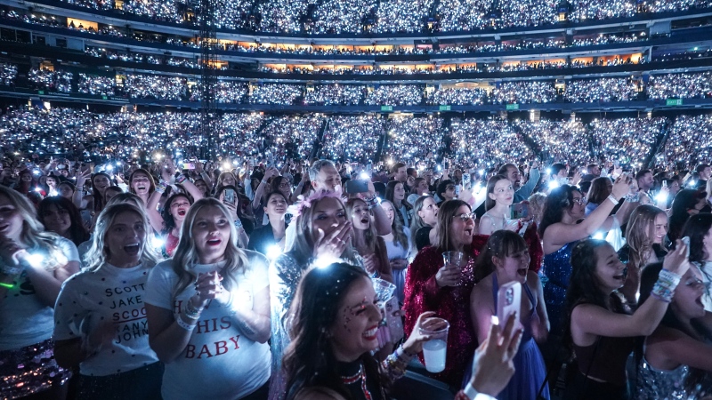 Fans react during the opening of Taylor Swift's performance during the opening show of the Toronto dates for The Eras Tour, on Thursday, November 14, 2024. THE CANADIAN PRESS/Chris Young