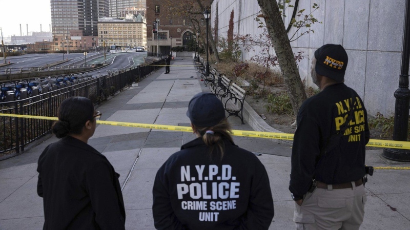 NYPD officers stand at the site of stabbing spree near the United Nations Headquarters in New York, Monday, Nov. 18, 2024. (AP Photo/Yuki Iwamura)