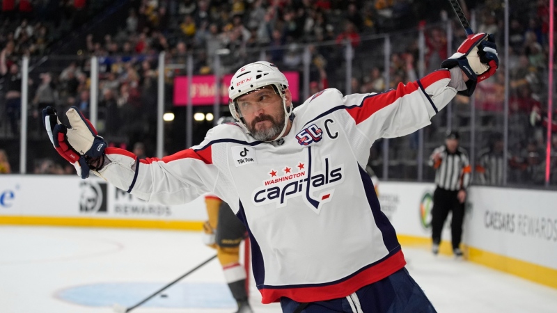 Washington Capitals left wing Alex Ovechkin (8) celebrates after scoring against the Vegas Golden Knights for a hat trick during the third period of an NHL hockey game, Nov. 17, 2024, in Las Vegas. (AP Photo/John Locher)