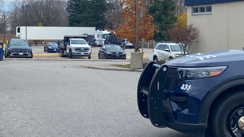 Police tactical vehicles ram a white RV in a parking lot, barricading an allegedly active shooter in Barrie Ont., on Nov. 19, 2024. (CTV News/ Mike Arsalides)