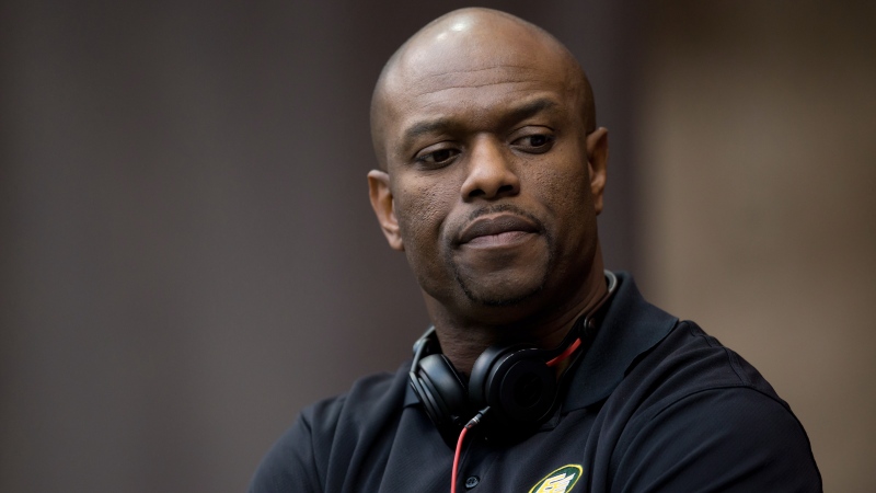 Edmonton general manager Ed Hervey stands on the sidelines before a CFL game against the B.C. Lions in Vancouver, B.C., on June 28, 2014. (Darryl Dyck/The Canadian Press)