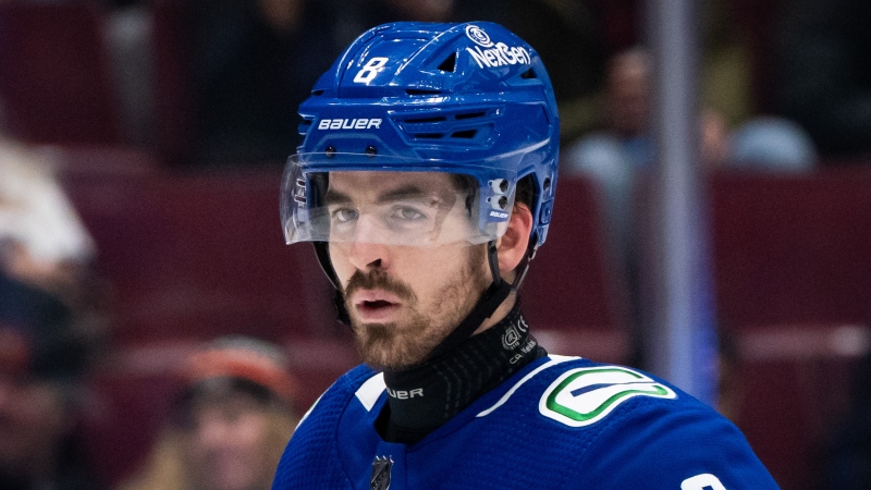 Vancouver Canucks' Conor Garland (8) is seen wearing neck protection during an NHL hockey game against the Philadelphia Flyers in Vancouver on Thursday, Dec. 28, 2023. THE CANADIAN PRESS/Ethan Cairns