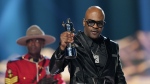 Maestro Fresh Wes receives the trophy signifying his induction into the Canadian Music Hall of Fame at the Juno awards, in Halifax, Sunday, March 24, 2024. (THE CANADIAN PRESS/Darren Calabrese)