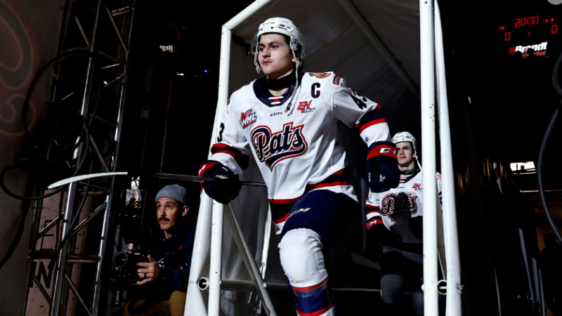 Tanner Howe jumps onto the ice with the Regina Pats before a game in the 2024-25 season. (Keith Hershmiller Photography) 