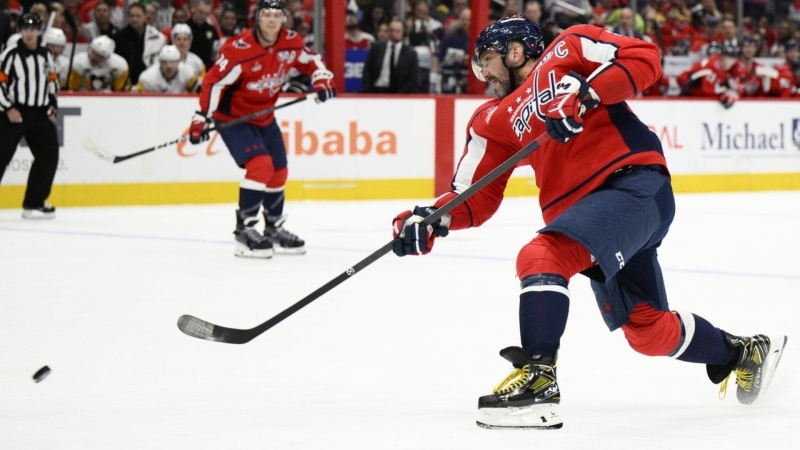 Washington Capitals left wing Alex Ovechkin shoots the puck during the first period of an NHL hockey game against the Pittsburgh Penguins, Friday, Nov. 8, 2024, in Washington. (AP Photo/Nick Wass)