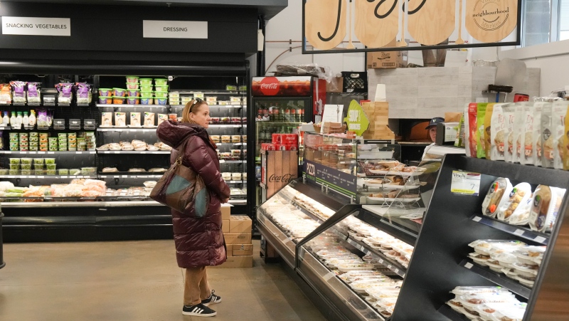 A custumer shops at Vince's Market, a grocery store in Sharon, Ont., on Thursday, Nov. 21, 2024. THE CANADIAN PRESS/Chris Young