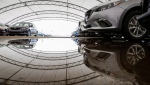 A car dealership has spent over a half million dollars building large tents to protect their vehicles from hail damage as shown in Calgary on Thursday, July 14, 2016. (THE CANADIAN PRESS/Jeff McIntosh)