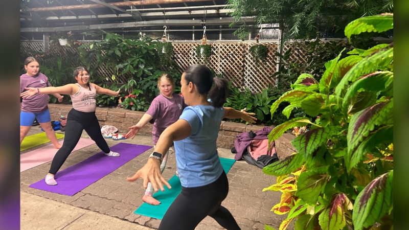 Girls in the Game yoga class at the Regina Floral Conservatory. (Brit Dort / CTV News) 