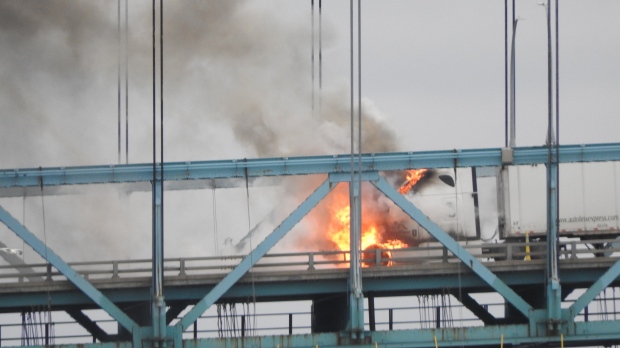 A transport truck on fire on the Ambassador Bridge in Windsor, Ont. on Nov. 22, 2024. (Source: Terry Greenwood)