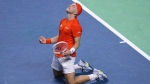 Netherlands' Tallon Griekspoor celebrates after winning against Germany's Jan-Lennard Struff during the Davis Cup semifinal at the Martin Carpena Sports Hall in Malaga, southern Spain, on Friday, Nov. 22, 2024. (AP Photo/Manu Fernandez)
