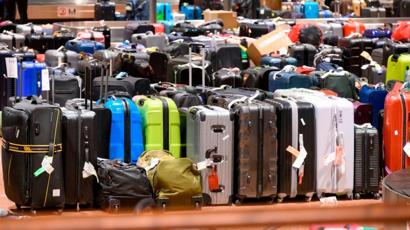 Hundred of suitcases, bags and baby carriages are stacked up at Hamburg Airport in Germany. (Jonas Walzberg/picture-alliance/dpa/AP via CNN Newsource)