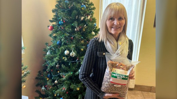 Tina Quiring, Board Chair and Treasurer of Southwestern Ontario Gleaners, seen with a bag of dehydrated vegetable mix in Windsor, Ont. on Nov. 23, 2024. (Robert Lothian/CTV News Windsor)