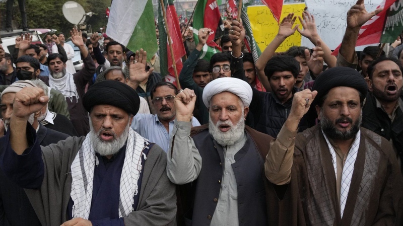 Shiite Muslims chant slogans to condemn the killing of Shiite Muslims by gunmen in an ambush in Kurram district, during a demonstration in Lahore, Pakistan, Friday, Nov. 22, 2024. (AP Photo/K.M. Chaudary)
