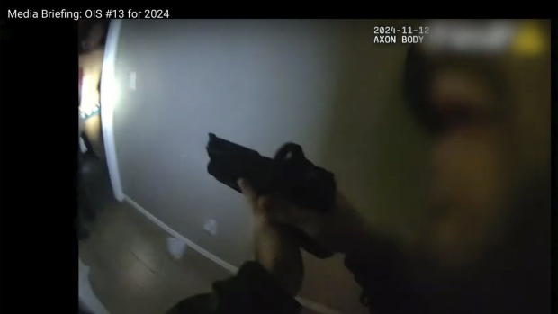 This police body camera image provided by Las Vegas Metropolitan Police shows police responding to a home invasion on Nov. 12, 2024 in Las Vegas. (Las Vegas Metropolitan Police via AP)