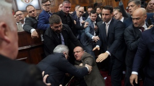 Ruling party lawmakers, opposition members, and some ministers fight during a Serbia's parliament session, which was scheduled to debate the 2025 budget, in Belgrade, Serbia, Monday, Nov. 25, 2024. (AP Photo)