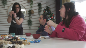 Members of Adults in Motion make Christmas ornaments.