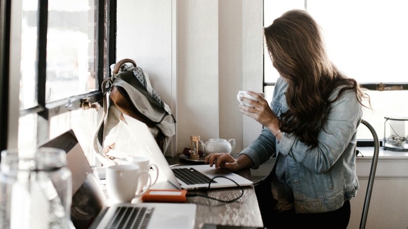 This is a file photo of a woman working. (Photo by Andrew Neel/Pexels)