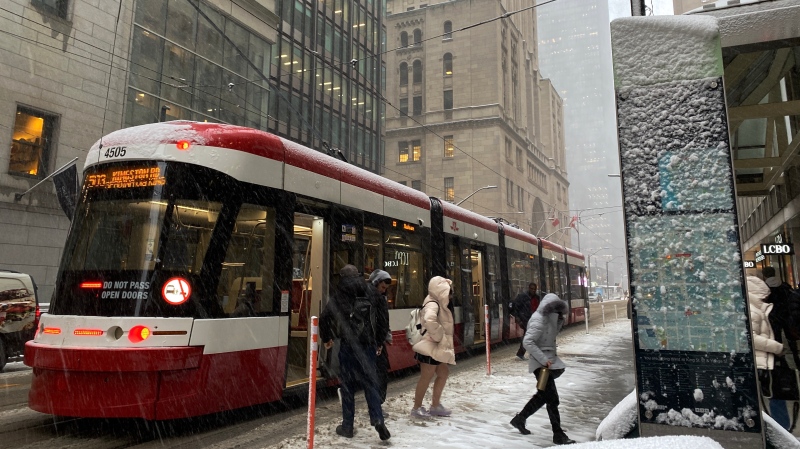 Passengers step off a streetcar during a snowy day in Toronto on Tuesday, Nov.15, 2022. THE CANADIAN PRESS/Graeme Roy